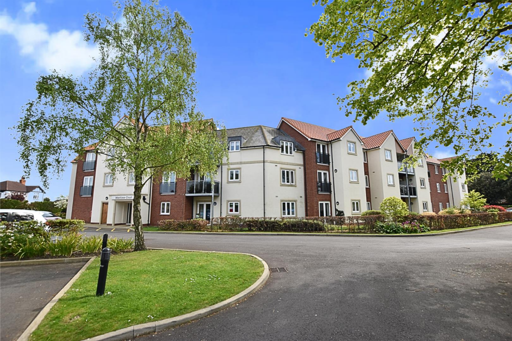 FRONT BUILDING VIEW WITH PARKING