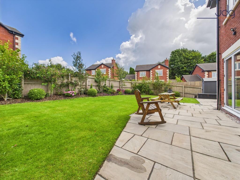 Lawn and Flagged Seating Area