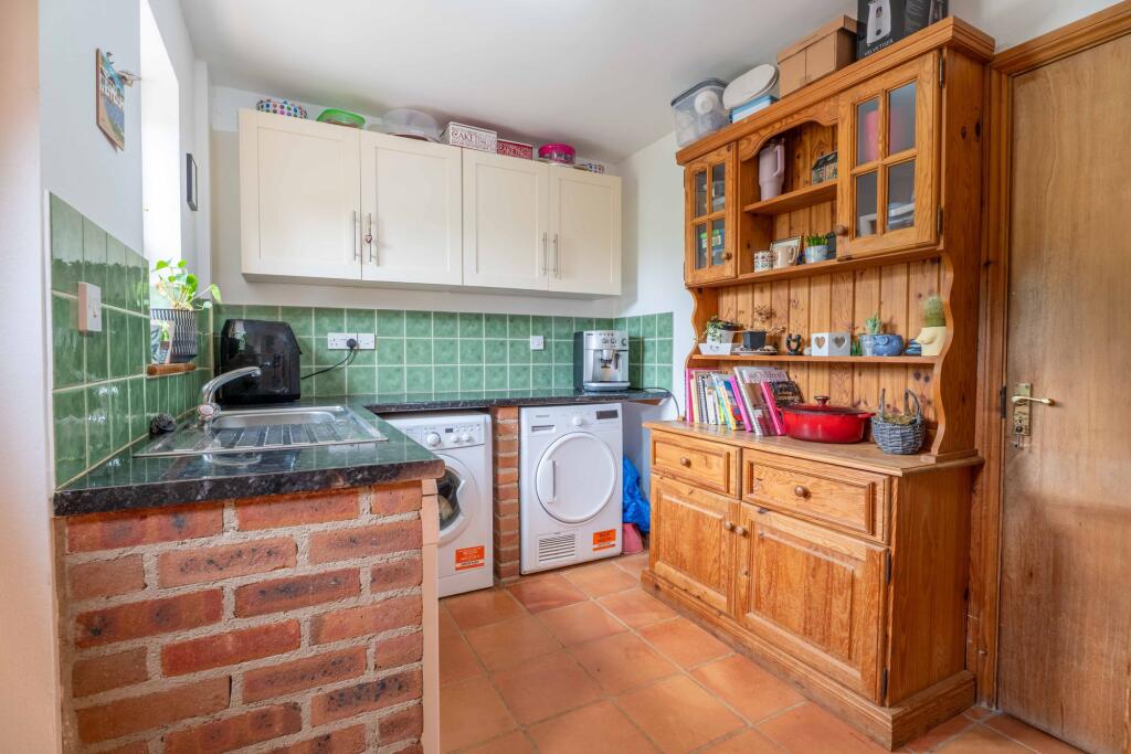 Utility Room and access to integral garage