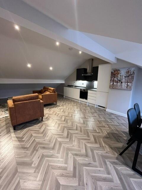 Bright and modern living space with ample natur...