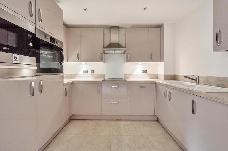 Kitchen with built-in appliances