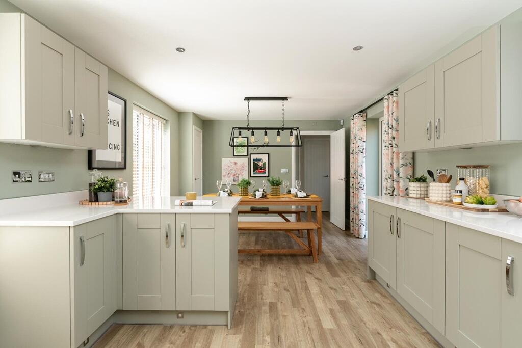 The large open plan kitchen/breakfast area features French doors to the rear garden