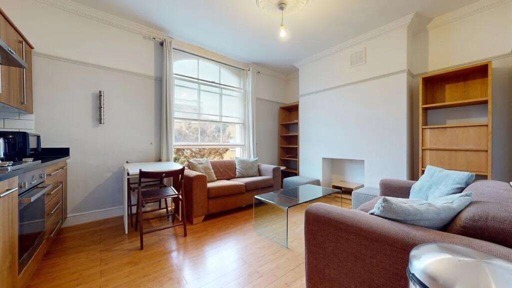 Bright and welcoming living room featuring larg...
