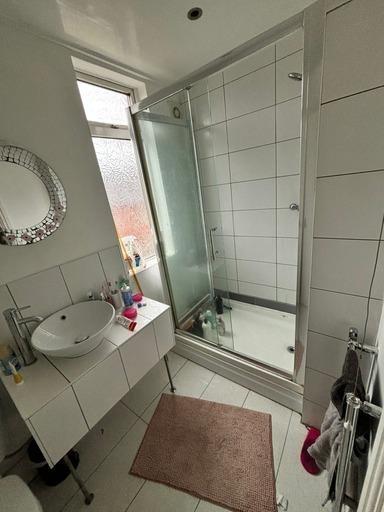 A clean and well-maintained bathroom featuring ...