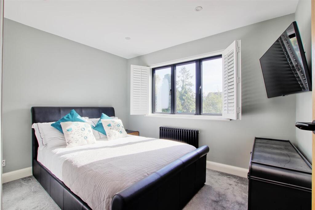 Bedroom two with shutter open.jpg