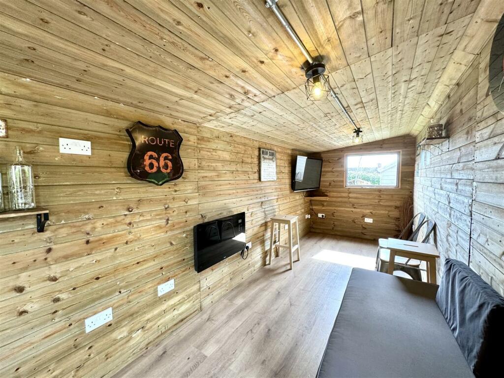 OUTSIDE HOME OFFICE/BAR/HOBBY ROOM