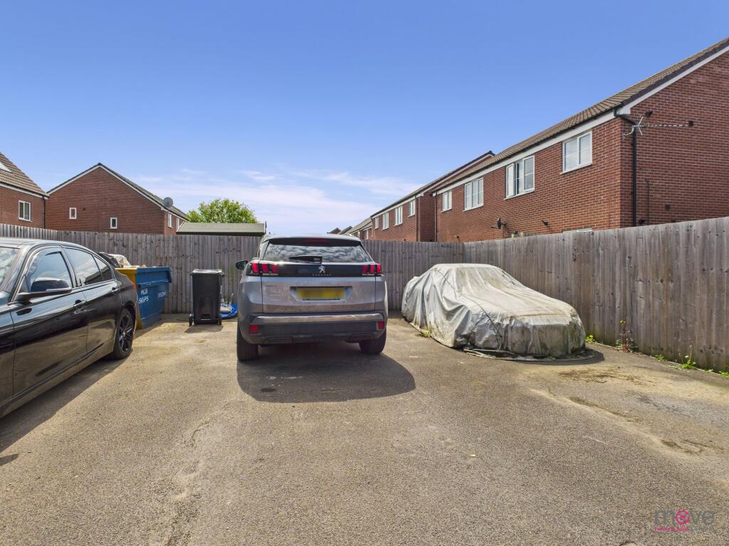 Two parking spaces with path to back garden