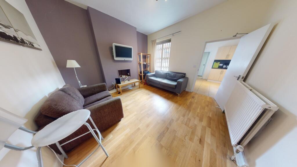 A bright and welcoming living room featuring a ...