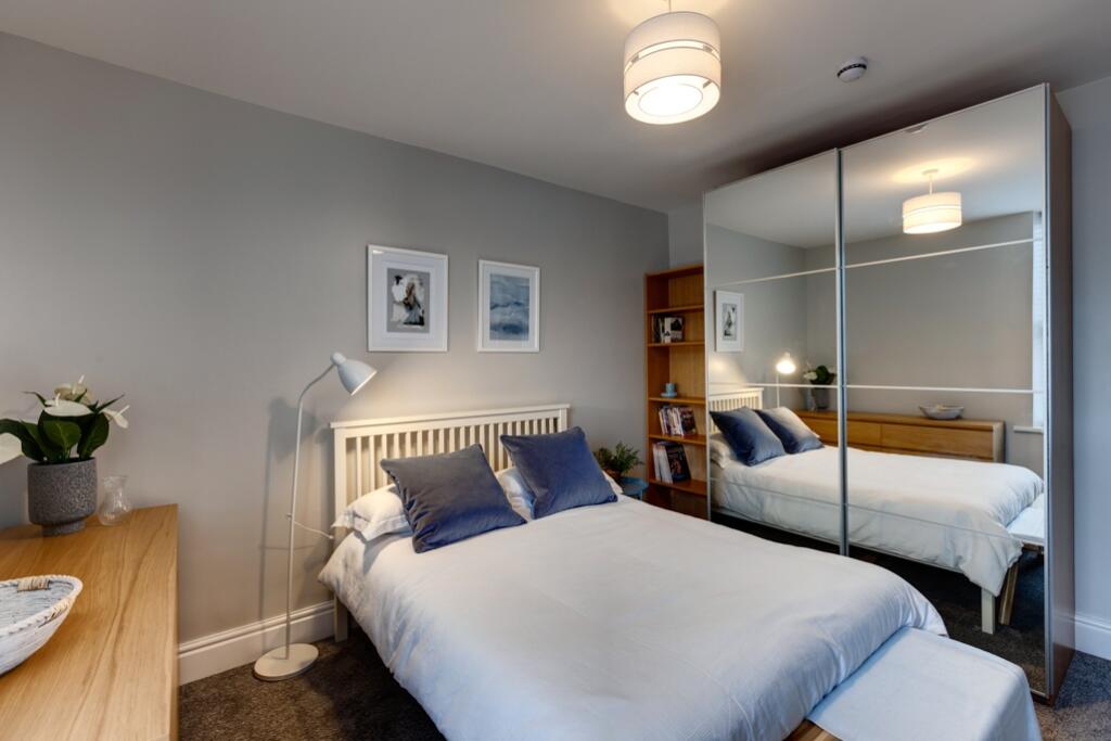 Bright and neatly presented master bedroom feat...