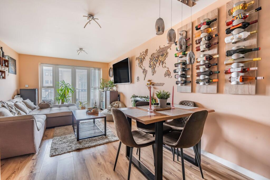 Open plan living space with balcony