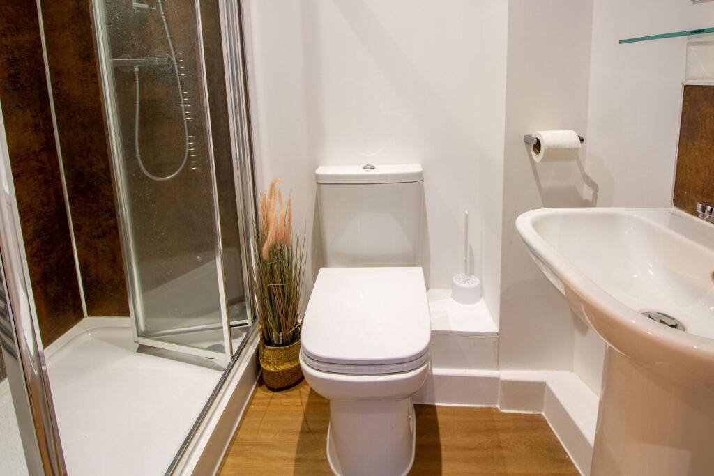 A modern and well-maintained bathroom featuring...