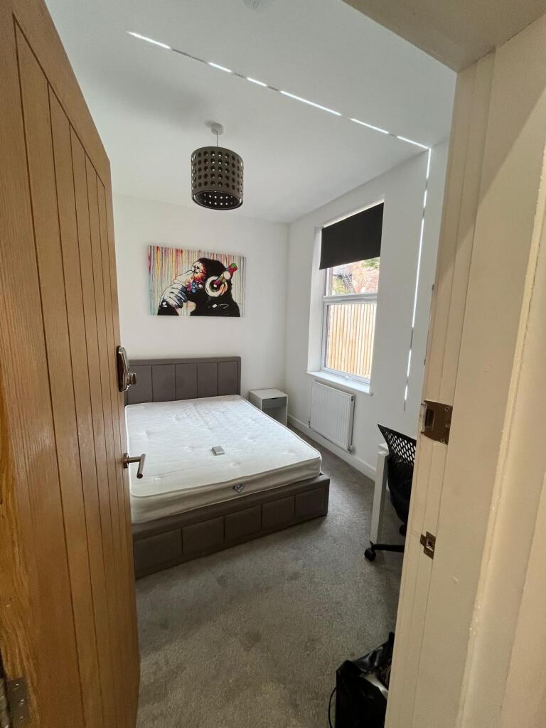 Bright, freshly decorated double bedroom with a...