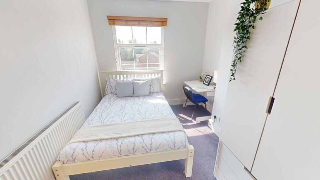 Bright and inviting master bedroom featuring a ...