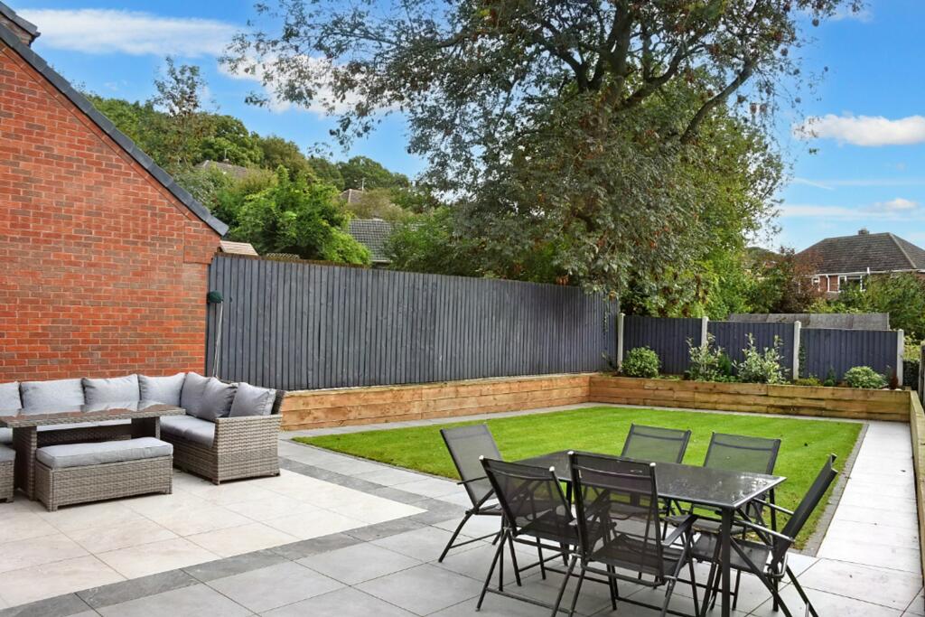 South facing patio and lawn area