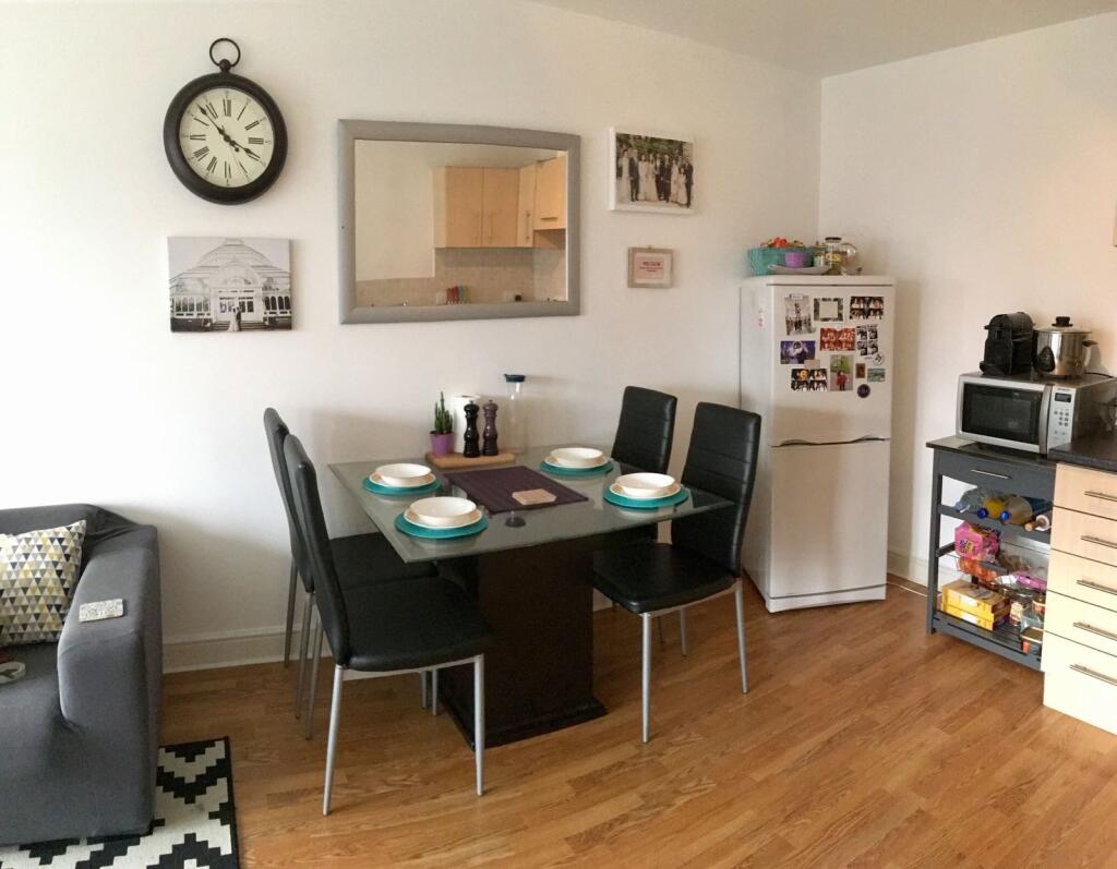 A modern living and dining area featuring a sty...