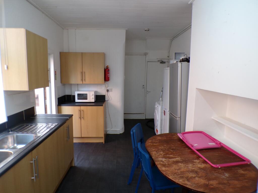 A functional and bright kitchenette with modern...