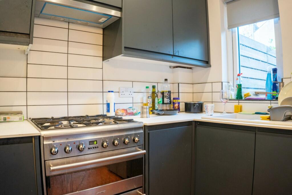 A modern and functional kitchenette with ample ...