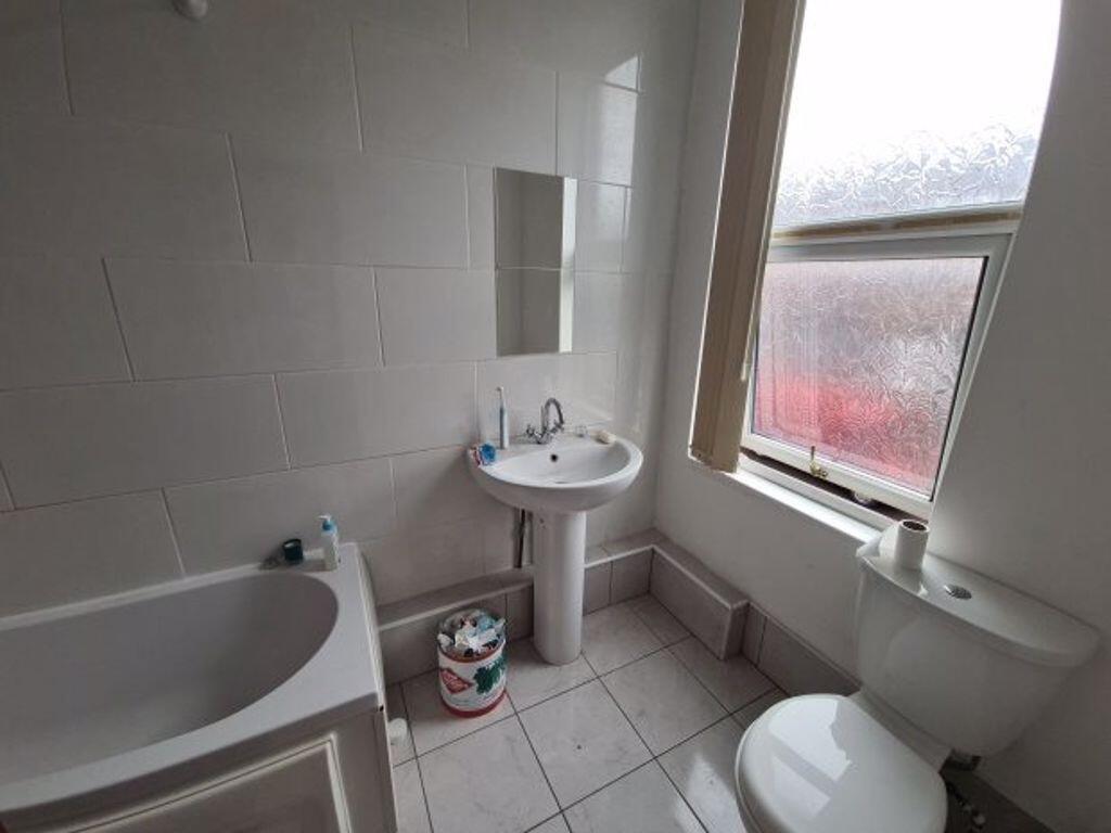 A clean and well-maintained bathroom with a lar...