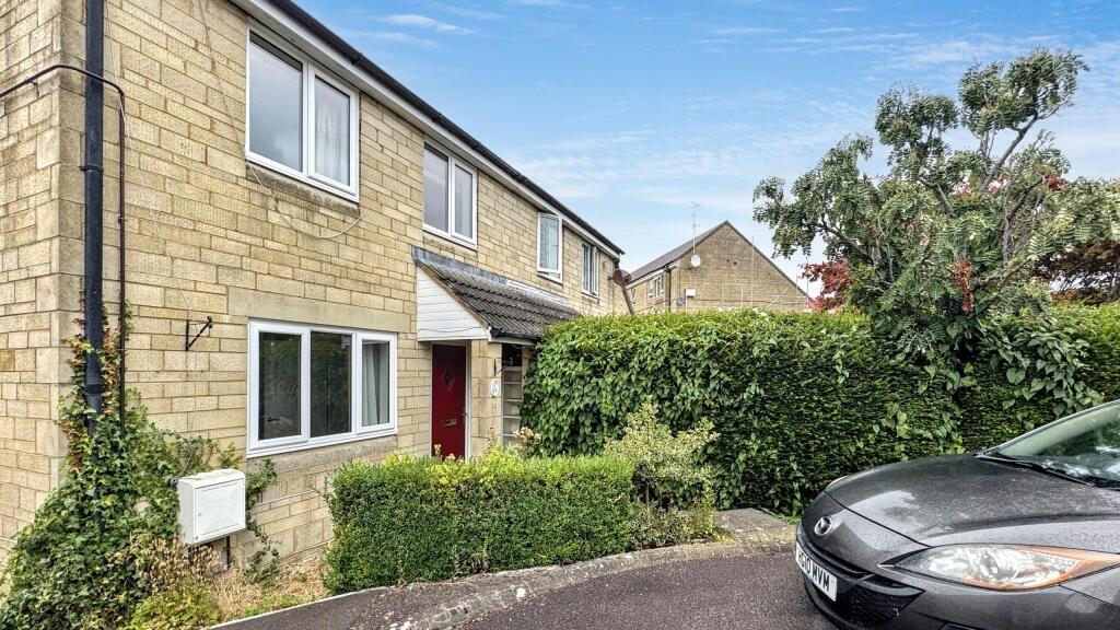A charming front view of a traditional terraced...