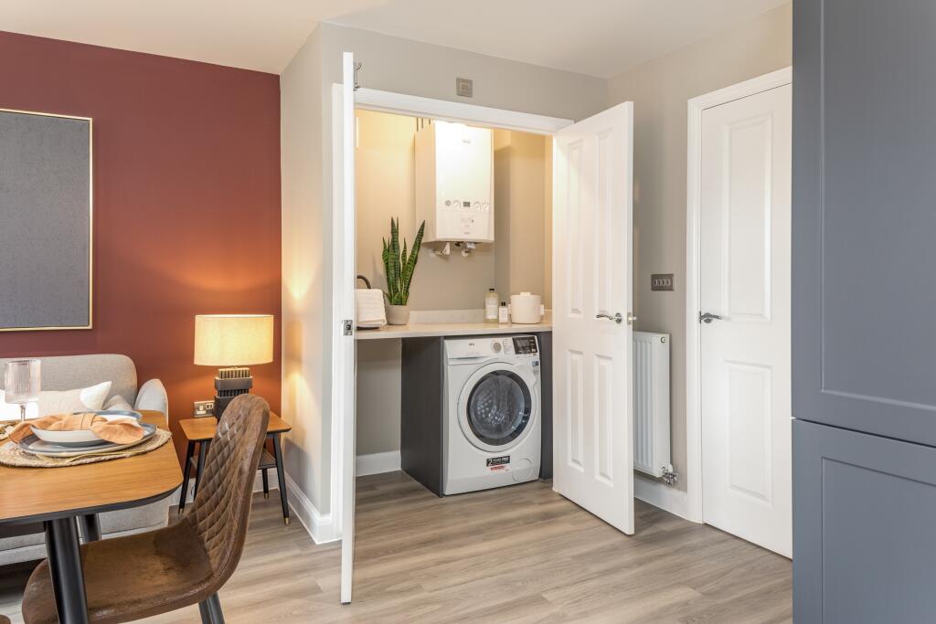 Utility cupboard in the Hanbury 4 bedroom home