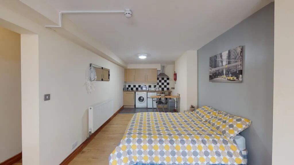 A bright and spacious kitchenette area featurin...