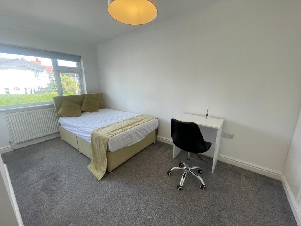 Bright and inviting double bedroom featuring a ...