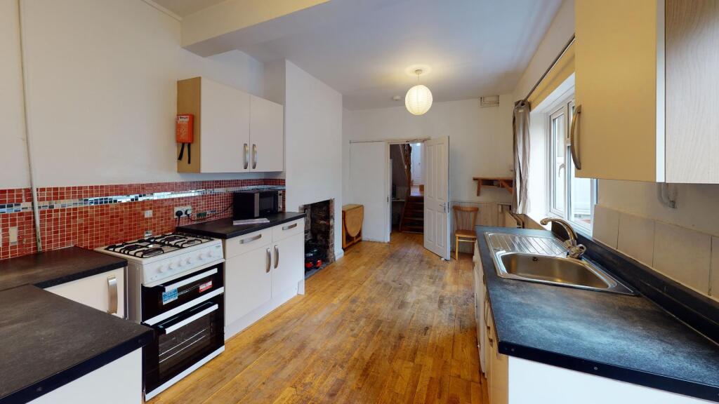 Bright and welcoming kitchen space featuring mo...