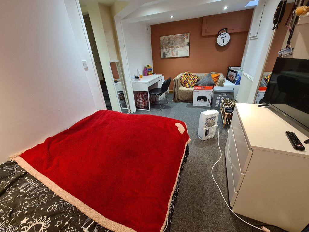 Comfortable and inviting bedroom featuring a co...