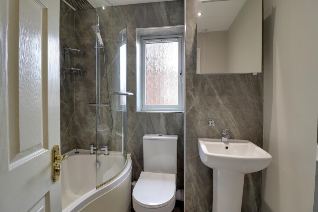 Family bathroom with over bath shower