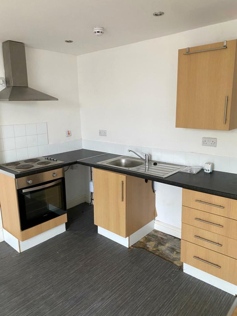 This kitchen features modern cabinetry and esse...