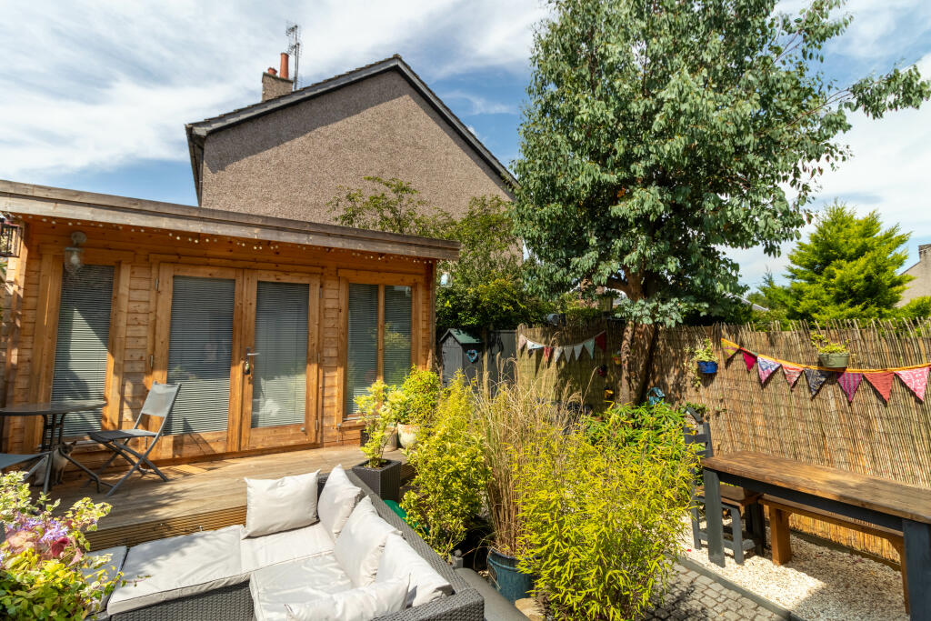 Rear Garden And Summer House