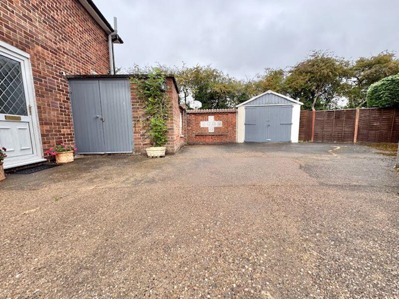 Driveway and garage view 2