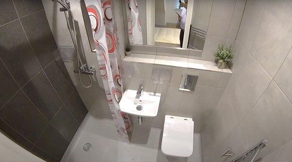 Modern, well-kept bathroom with a walk-in showe...