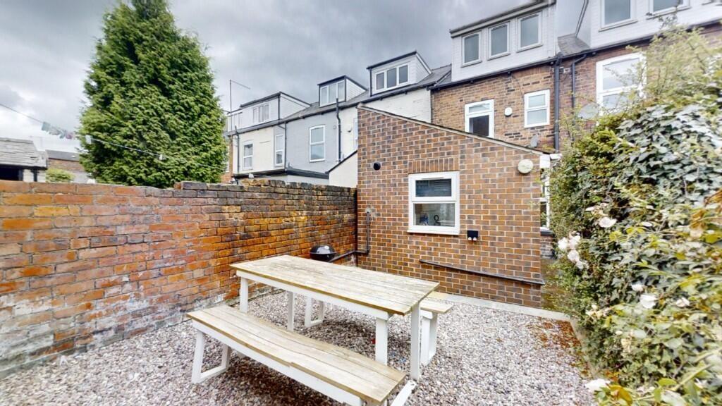 A private and well-maintained garden area featu...