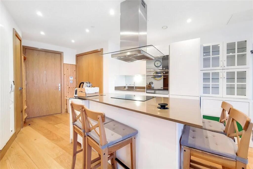 Modern kitchen with a sleek island countertop a...