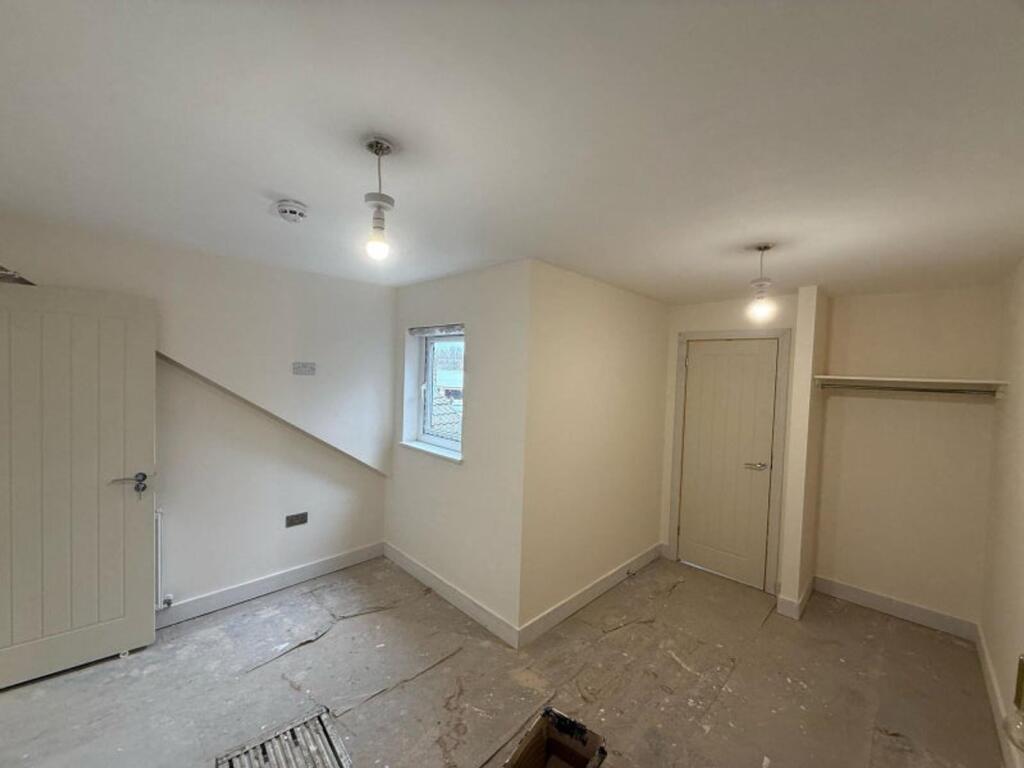 A bright and inviting hallway space with potent...