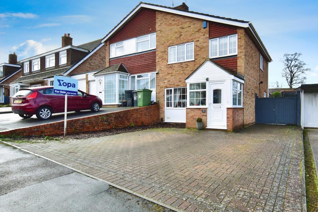 Outside View Of The Property With Driveway Parking
