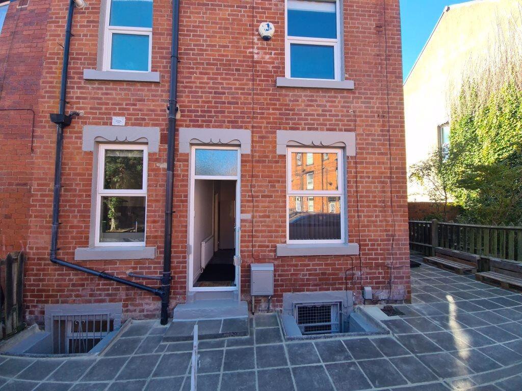Charming red-brick terraced house front with cl...