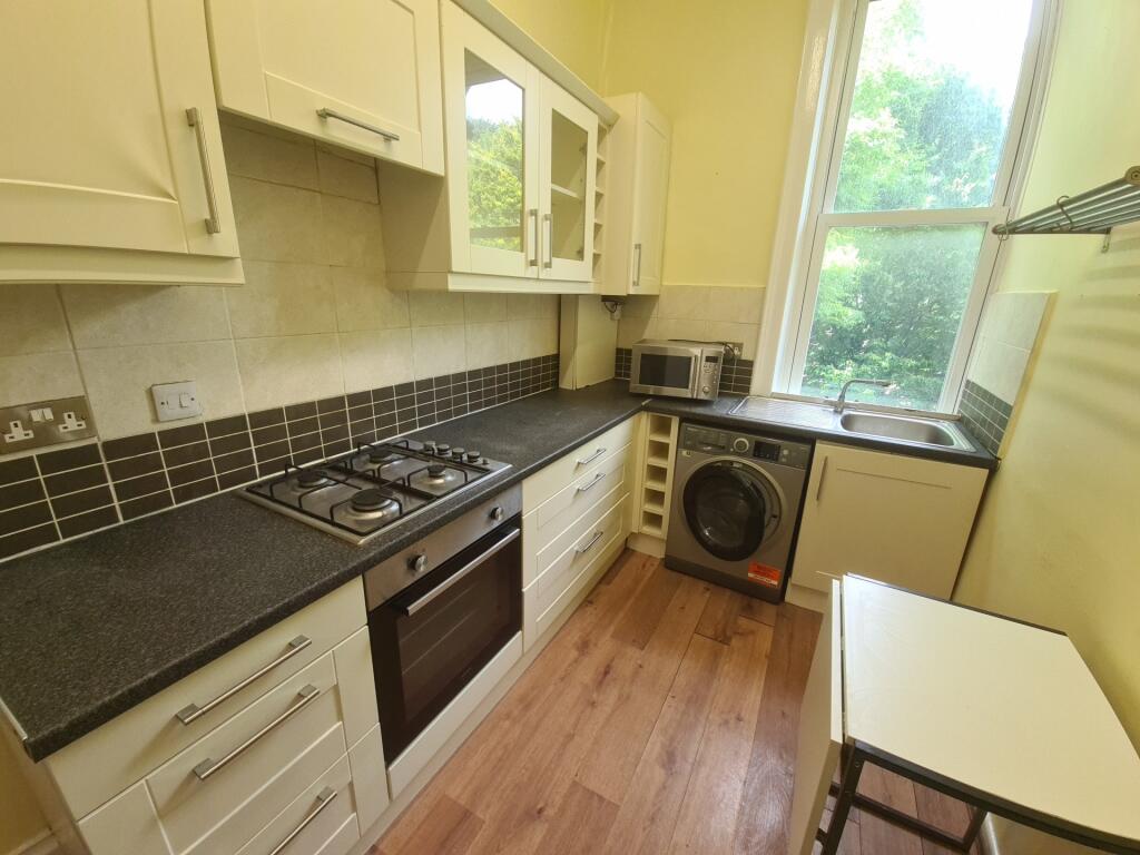 Bright and functional kitchen featuring ample n...