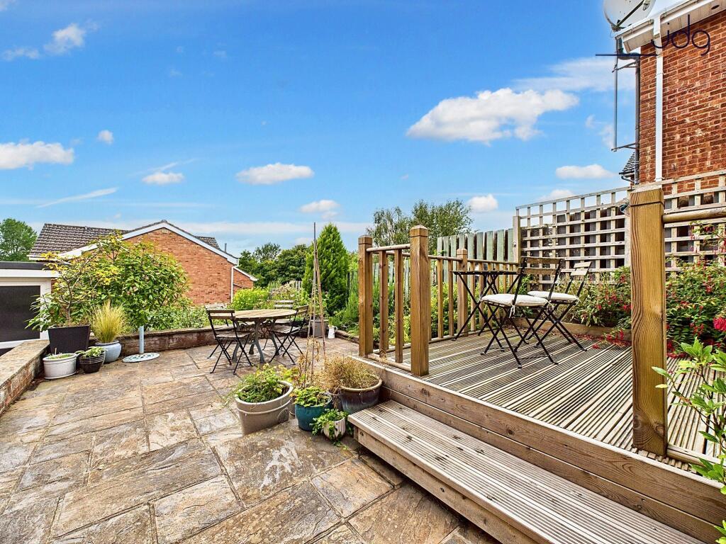 Tiered Garden with plenty of seating areas, flagged, decked and mixed lawn.