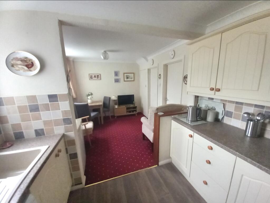 KITCHEN THROUGH TO DINING ROOM