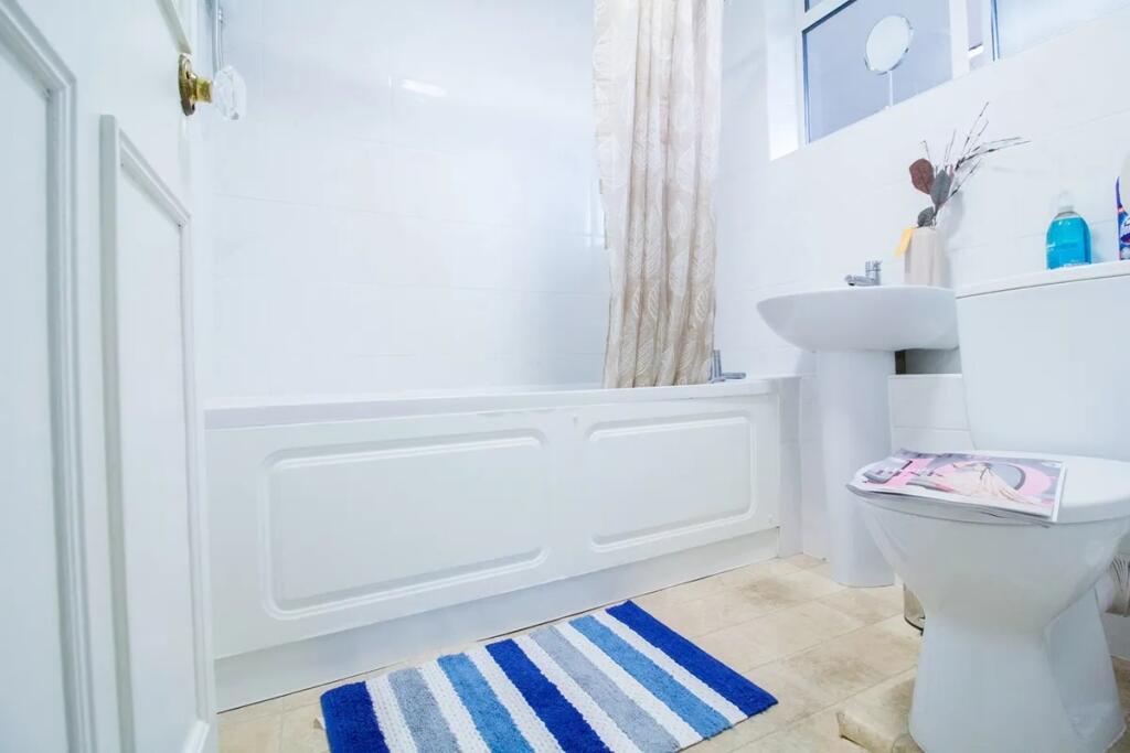 Bright and clean bathroom featuring a full bath...