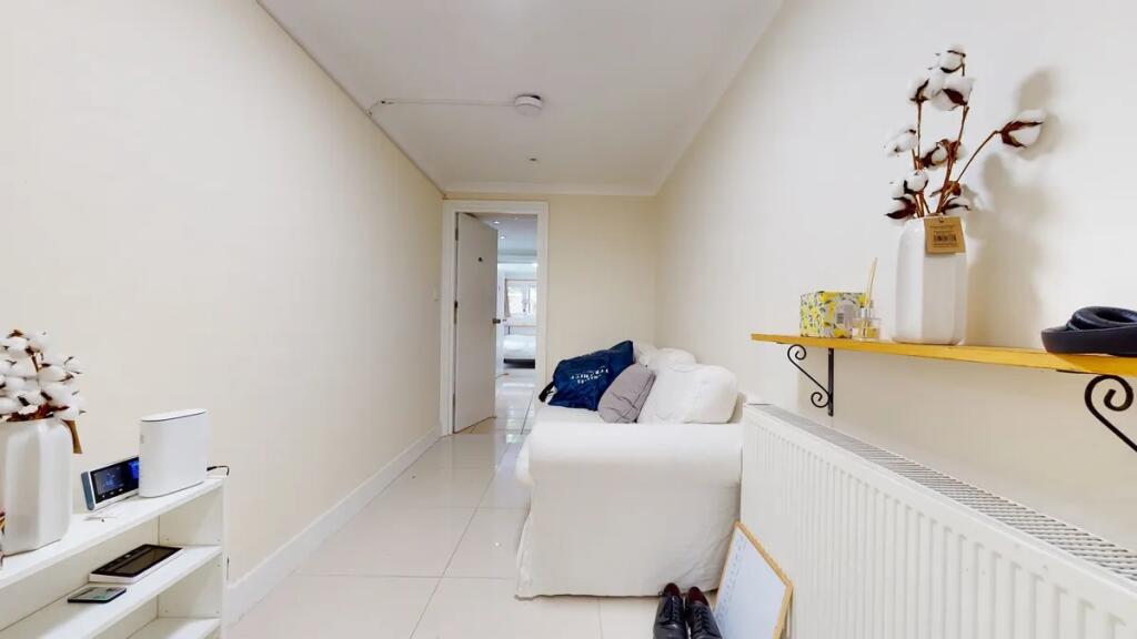 A clean and bright hallway featuring light-colo...