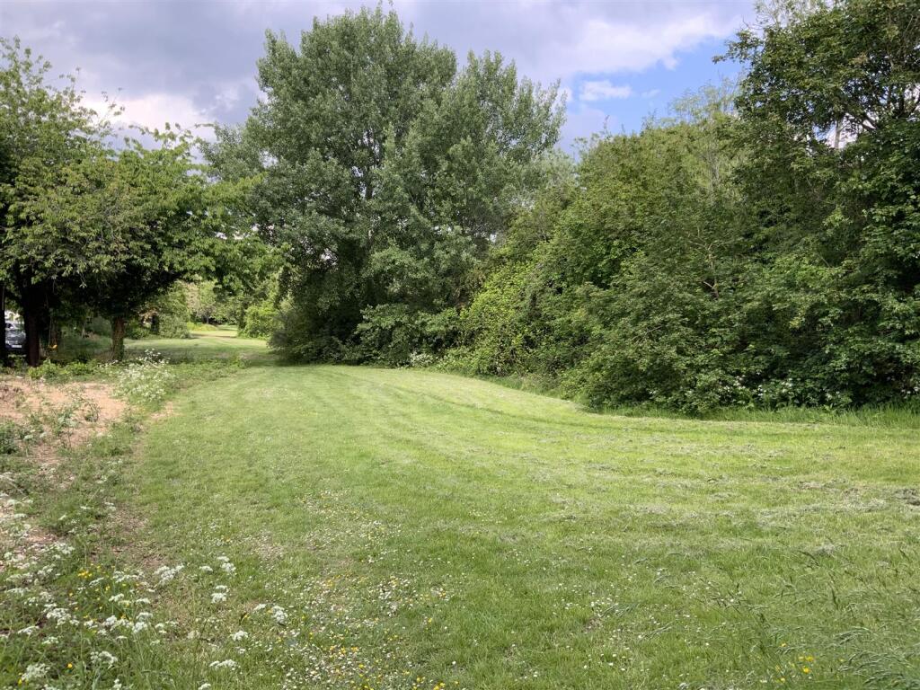 Parkland to the side of the property