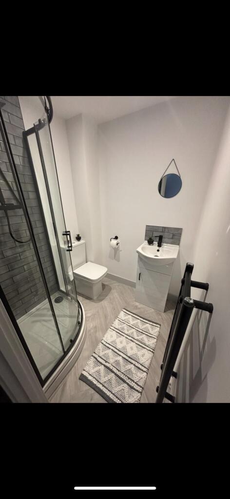 This modern bathroom features a sleek design wi...