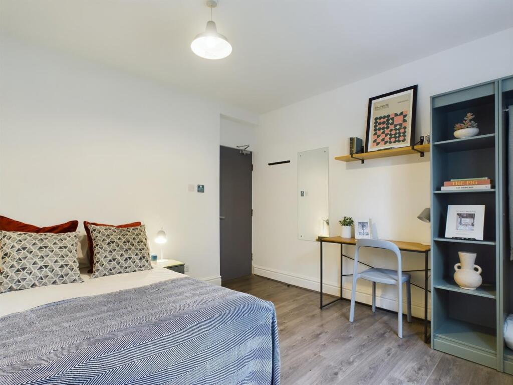 A stylish and inviting double bedroom featuring...
