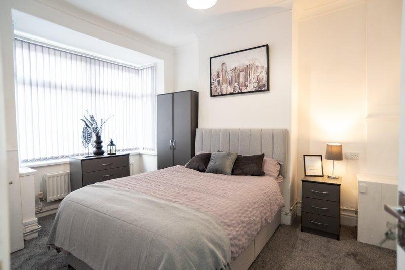 Bright and inviting double bedroom featuring a ...