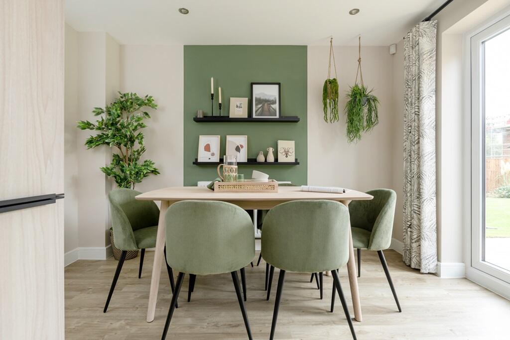 The dining area features double doors to the garden