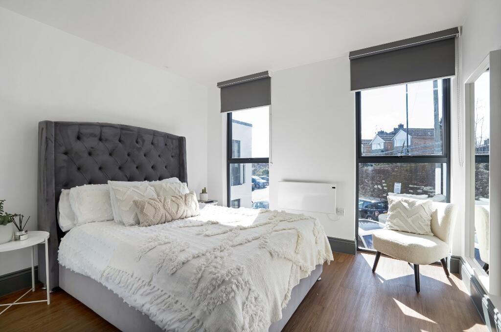 Bright and inviting double bedroom featuring a ...