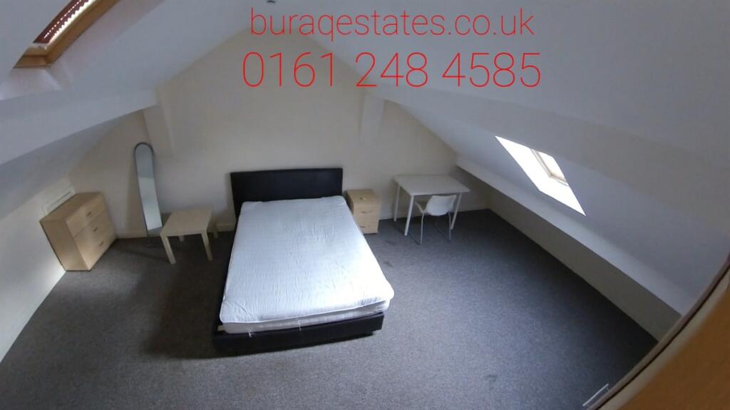 Bright and spacious master bedroom featuring a ...